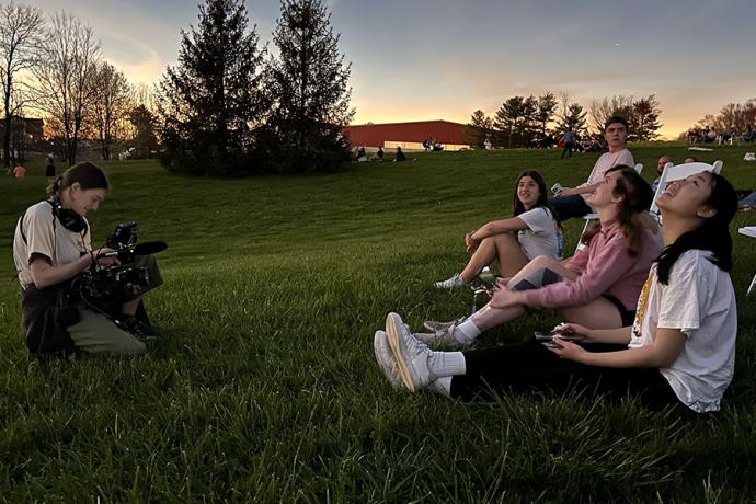 Film & New Media students watch the eclipse at a Greenacres farm